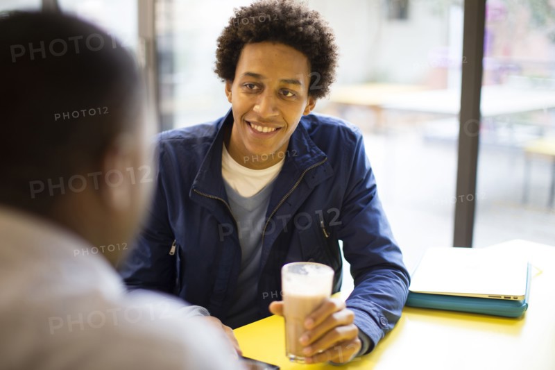 Men drinking coffee in cafe