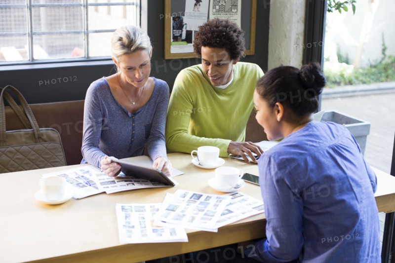 Business people using digital tablet in office meeting