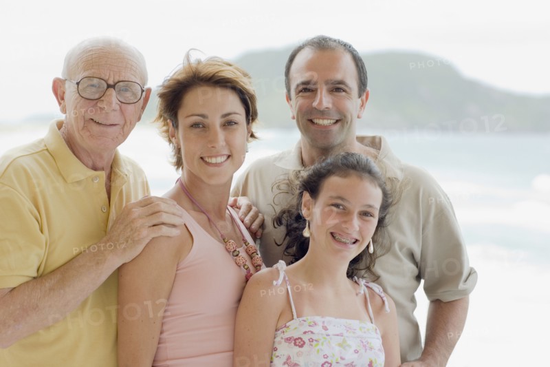 Family smiling outdoors