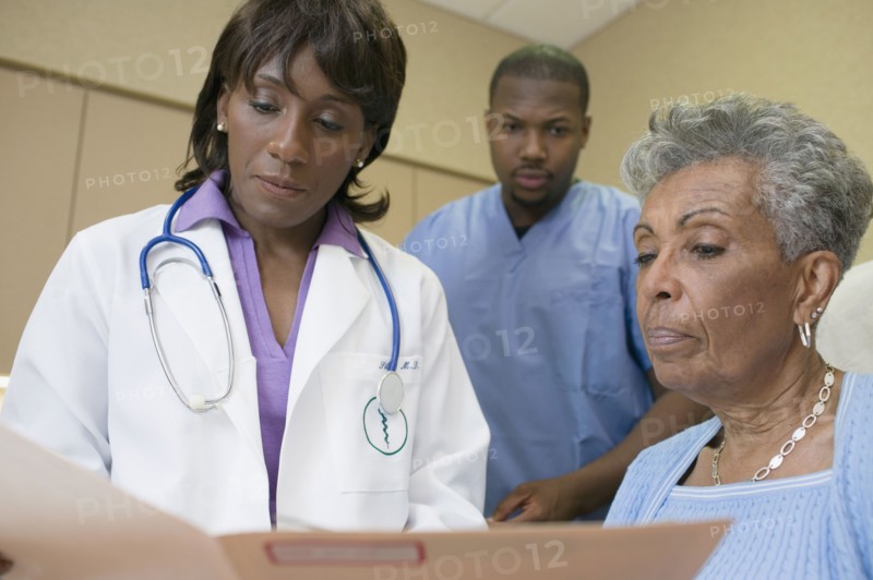 African female doctor with co-workers