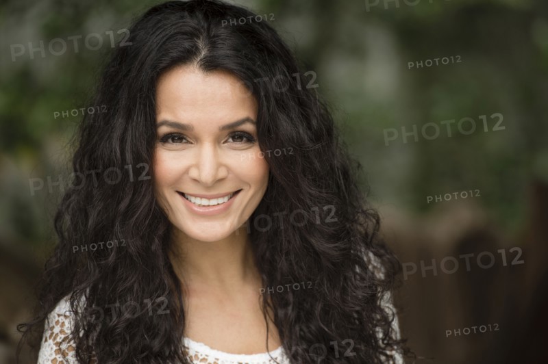 Hispanic woman smiling outdoors