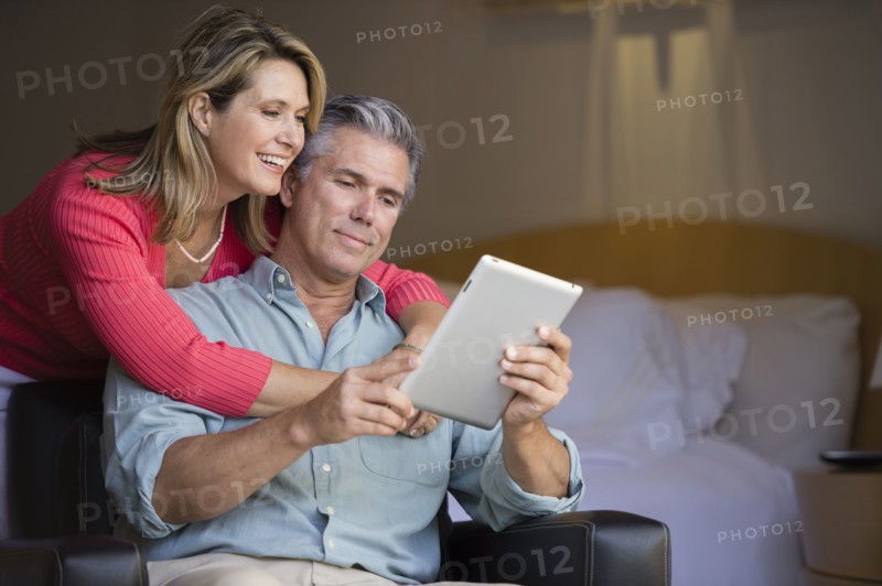Caucasian couple using tablet computer