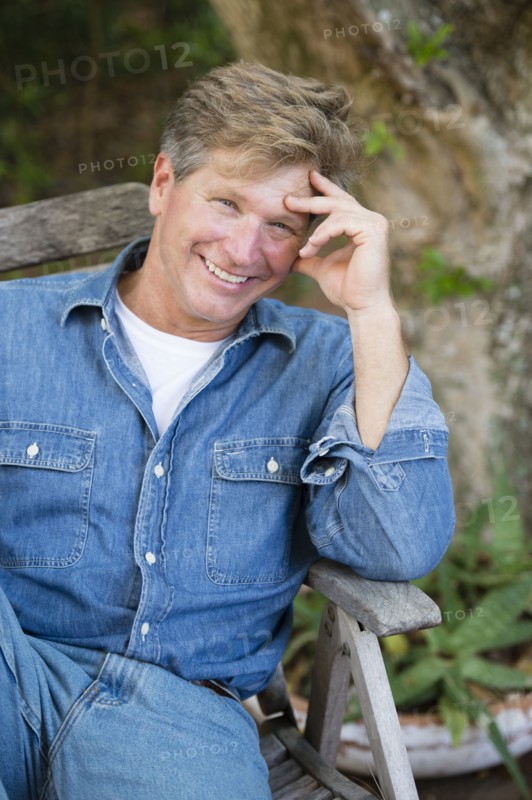 Caucasian man sitting outdoors