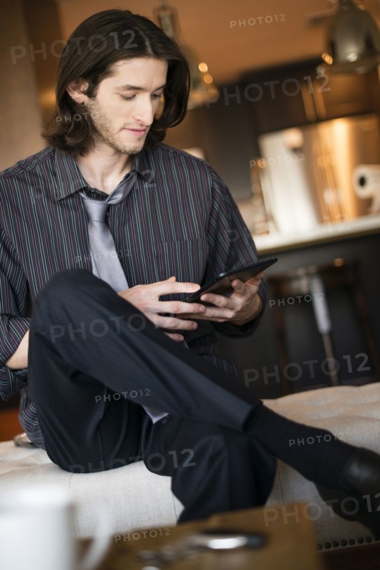 Caucasian businessman using digital tablet