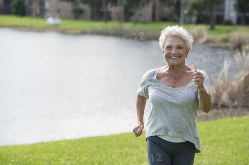 Senior Caucasian woman jogging in park