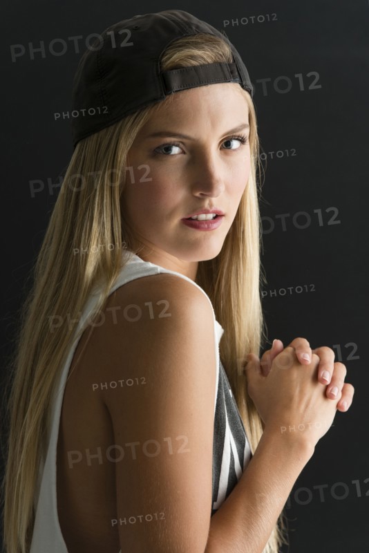 Serious Caucasian woman looking over her shoulder