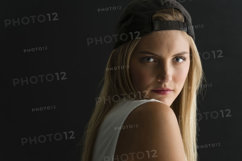 Serious Caucasian woman looking over her shoulder