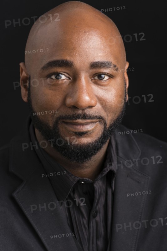 Close up of black businessman smiling