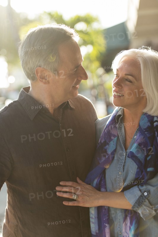 Older Caucasian couple walking outdoors