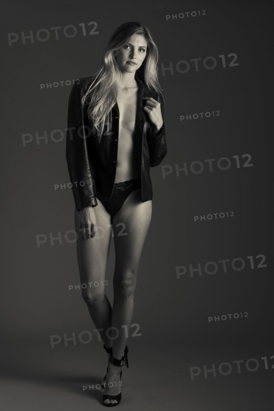 Stylish Caucasian woman wearing lingerie and leather jacket