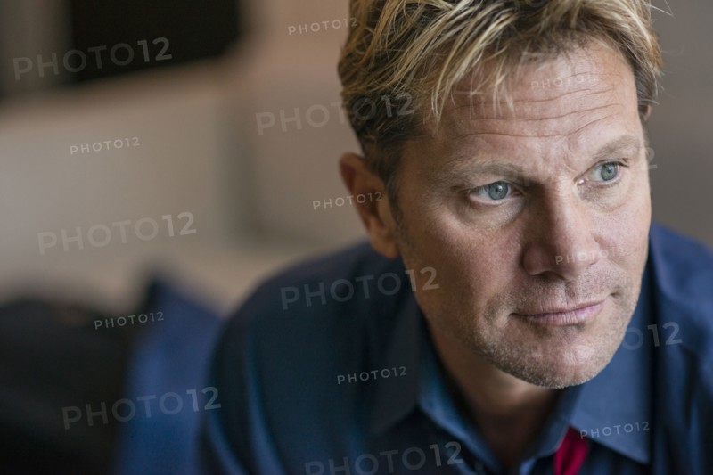Close up of Caucasian businessman in office lobby