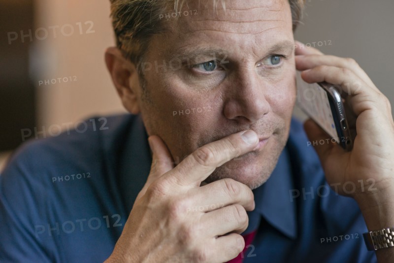 Caucasian businessman talking on cell phone