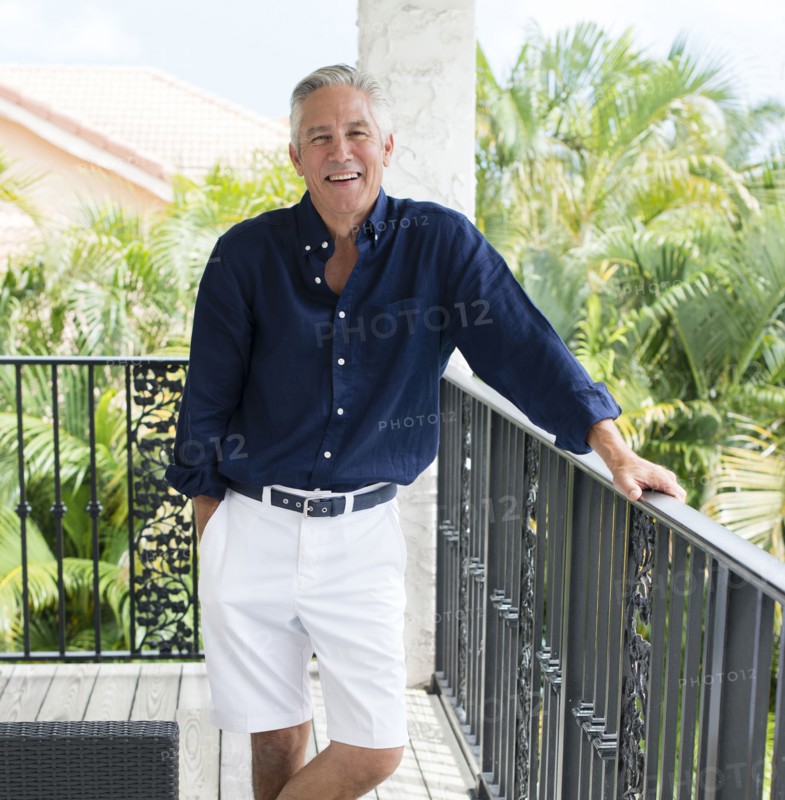 Caucasian man smiling on patio