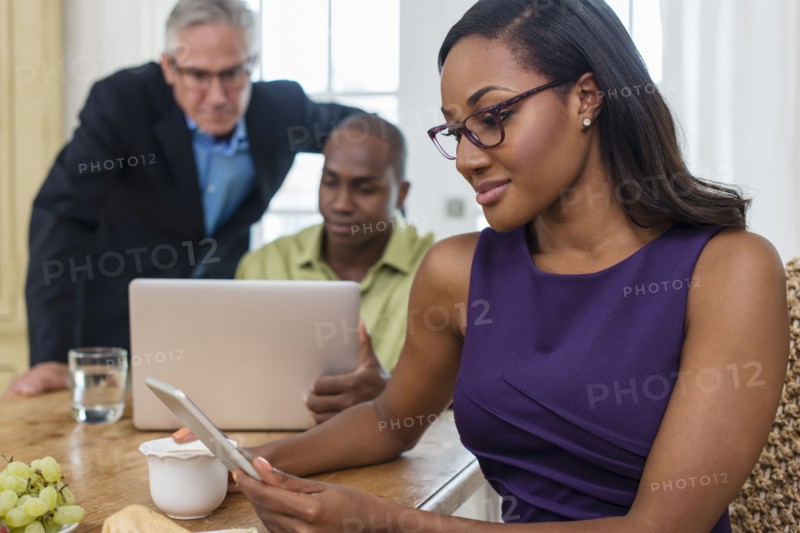 Friends using laptop at party
