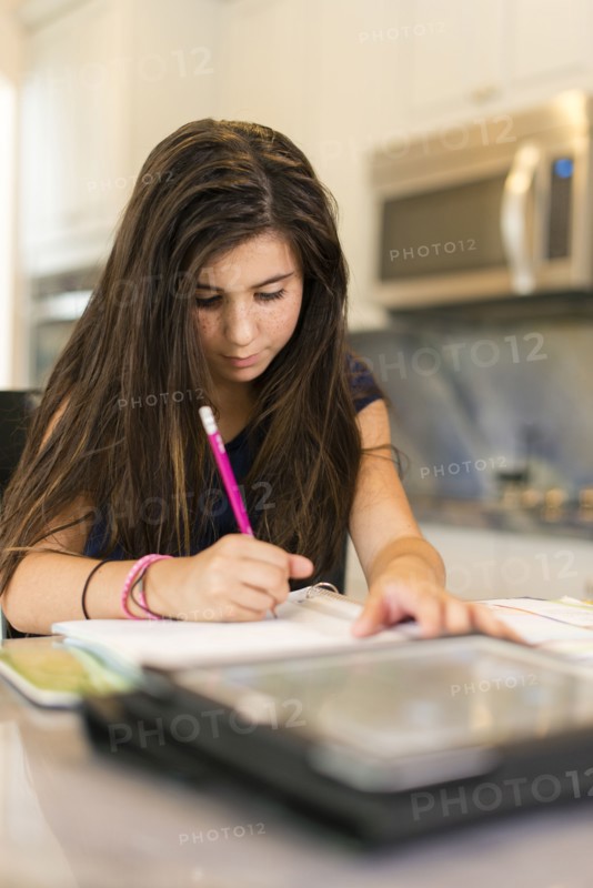 Mixed race girl doing homework