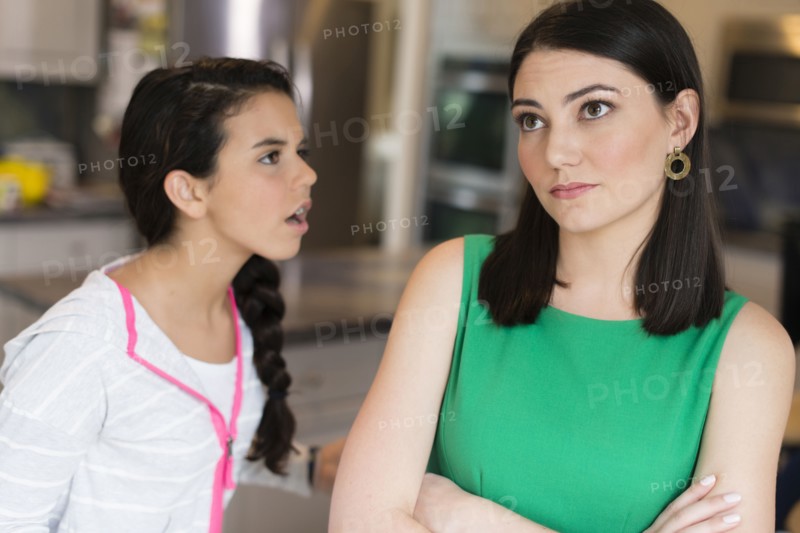 Mother and daughter arguing in kitchen