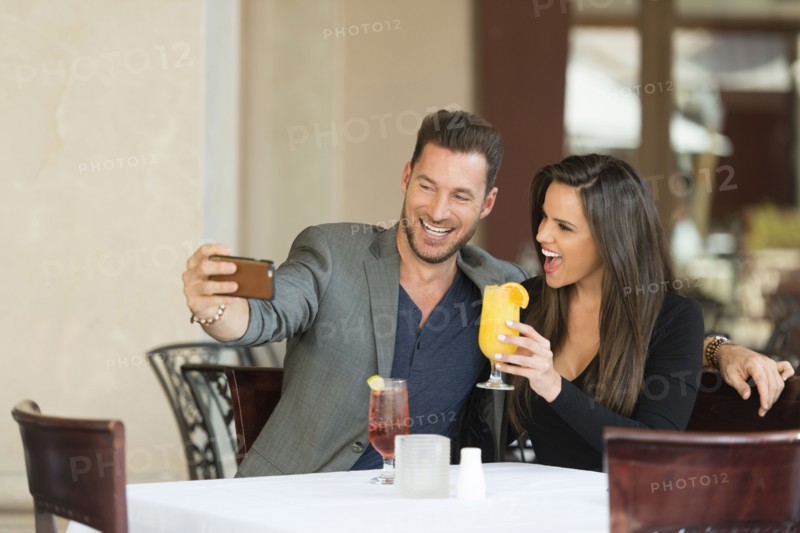 Couple taking selfie in restaurant