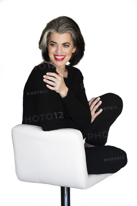 Caucasian woman sitting on stool
