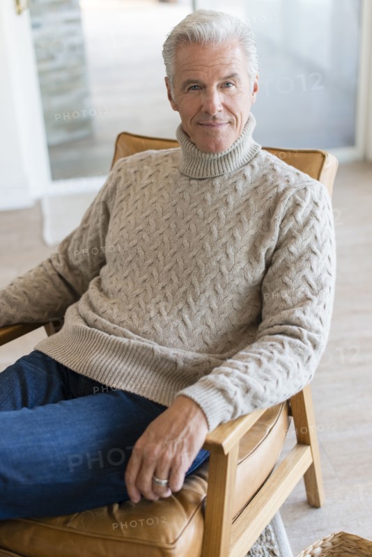 Caucasian man sitting in armchair