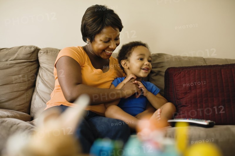 African mother playing with young son