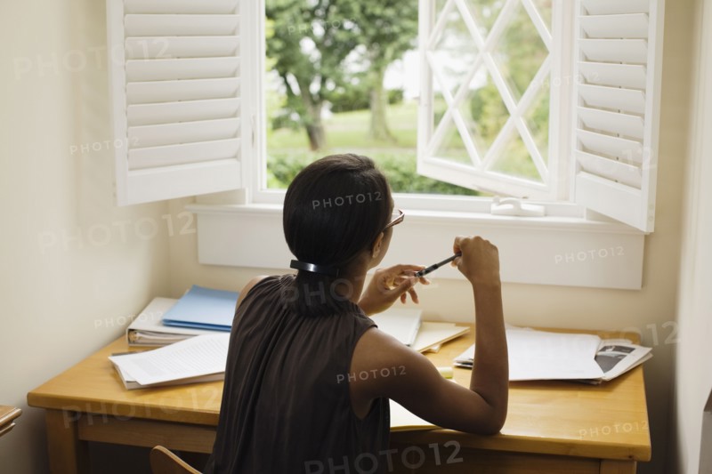 African woman sitting at desk