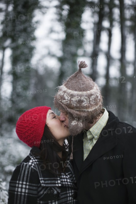 Couple kissing outdoors