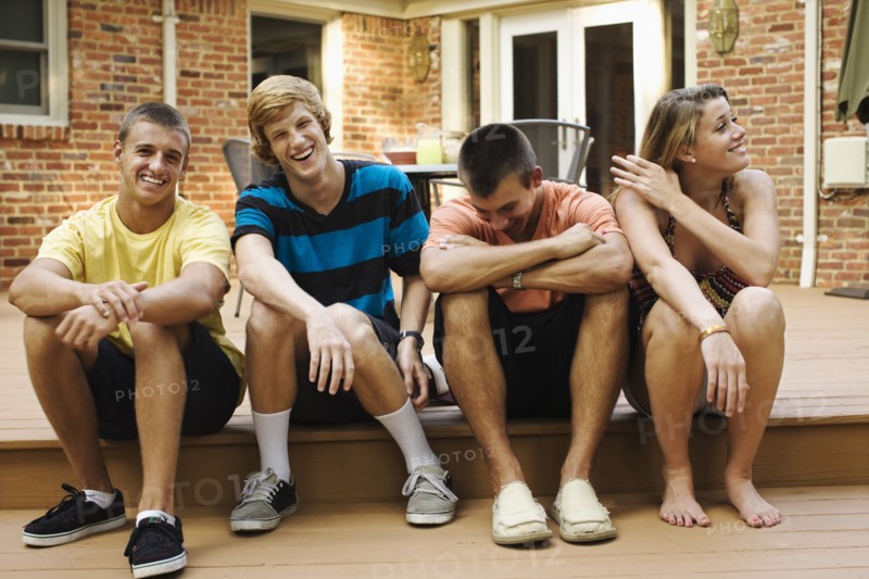 Friends hanging out together on patio