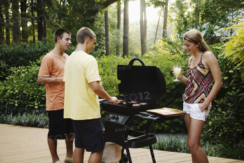 Friends hanging out together barbecuing