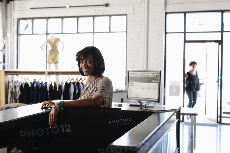 African American woman working in clothing store