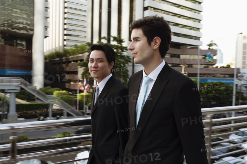 Businessmen walking together outdoors