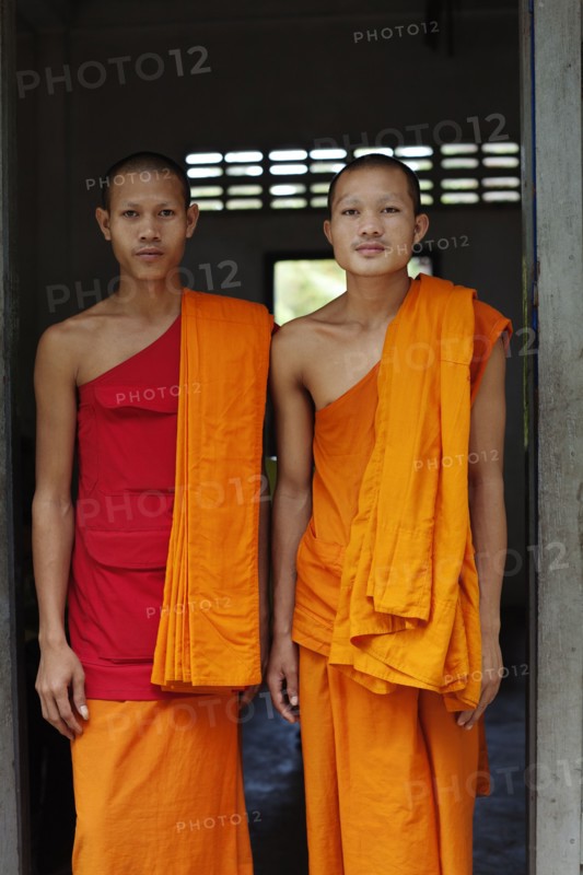 Cambodian monks standing in doorway