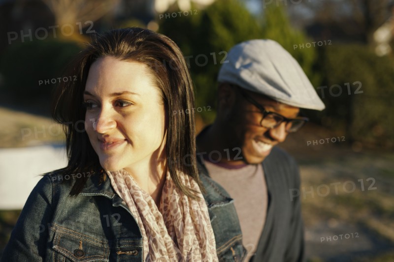 Smiling couple standing outdoors