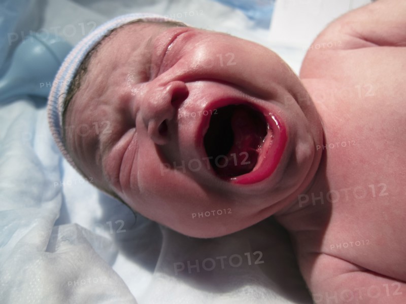 Crying Caucasian newborn baby boy