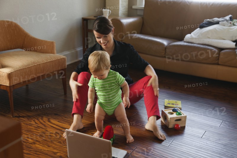 Caucasian mother playing with toddler
