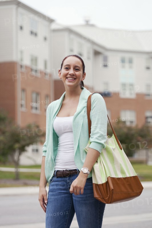 Caucasian student walking on campus
