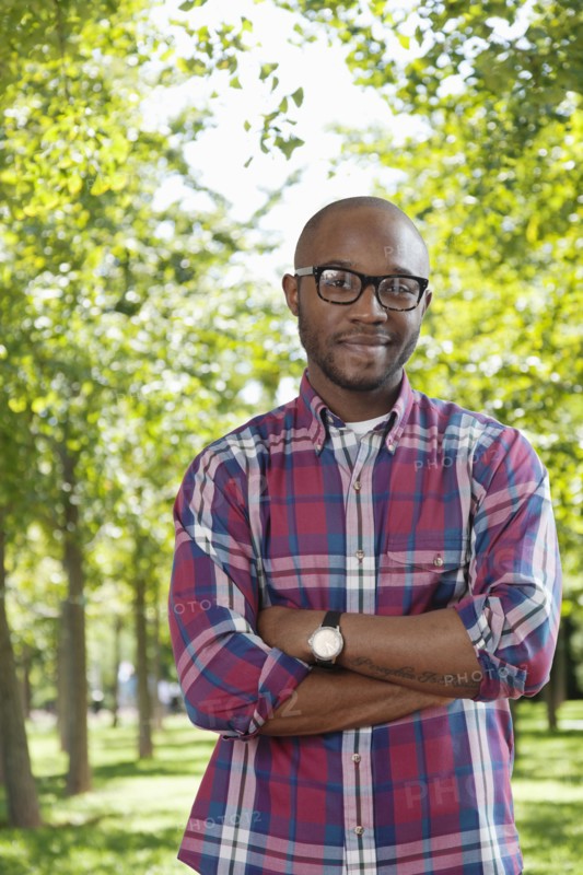 Black man smiling in park