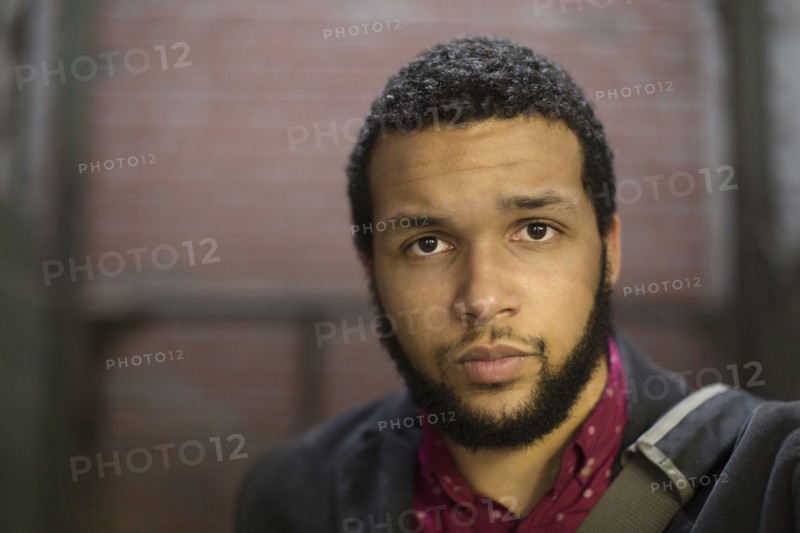 Serious mixed race businessman