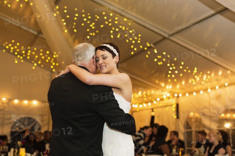 Bride dancing with father at reception