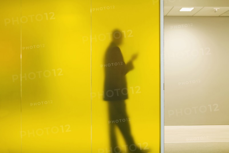 Silhouette of Caucasian businessman in office