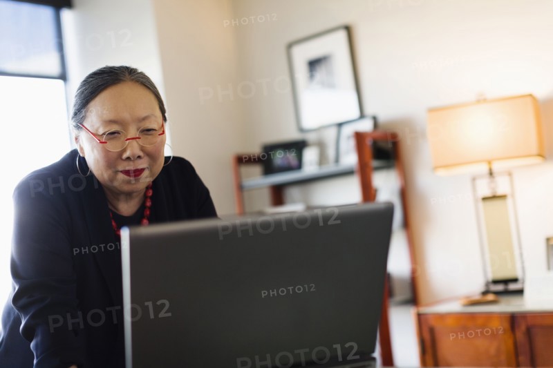 Japanese businesswoman working at desk