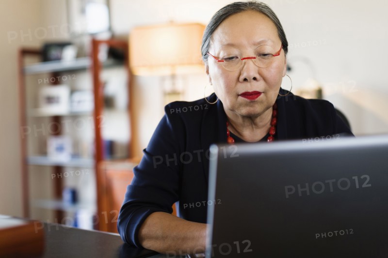 Japanese businesswoman working at desk