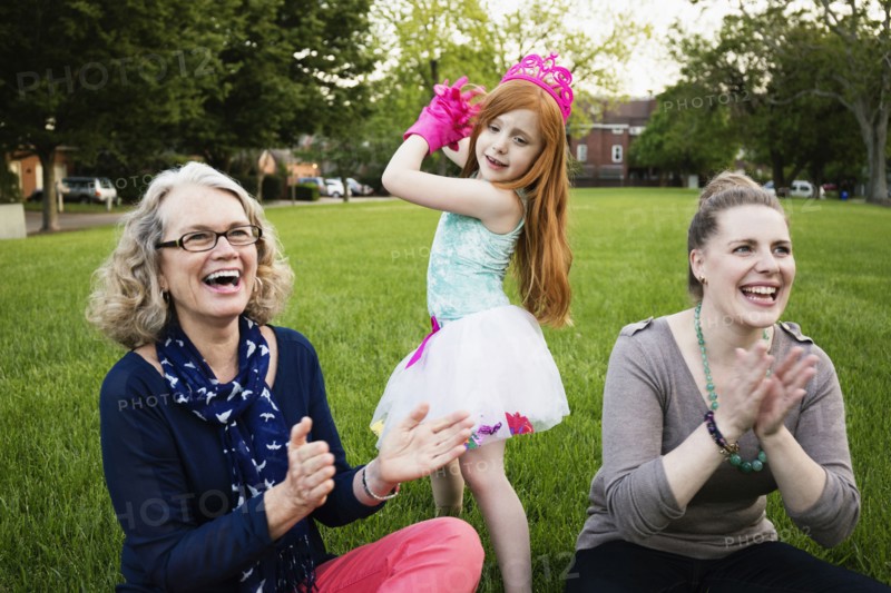 Three generations of Caucasian women relaxing in park