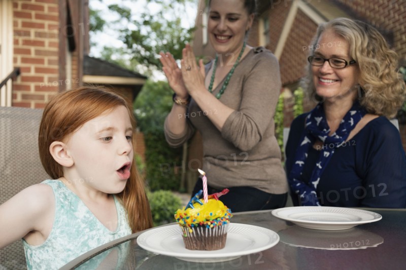 Three generations of Caucasian women celebrating birthday