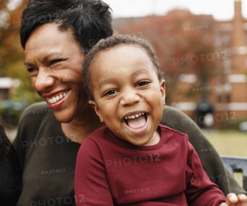 Close up of African American mother and son laughing