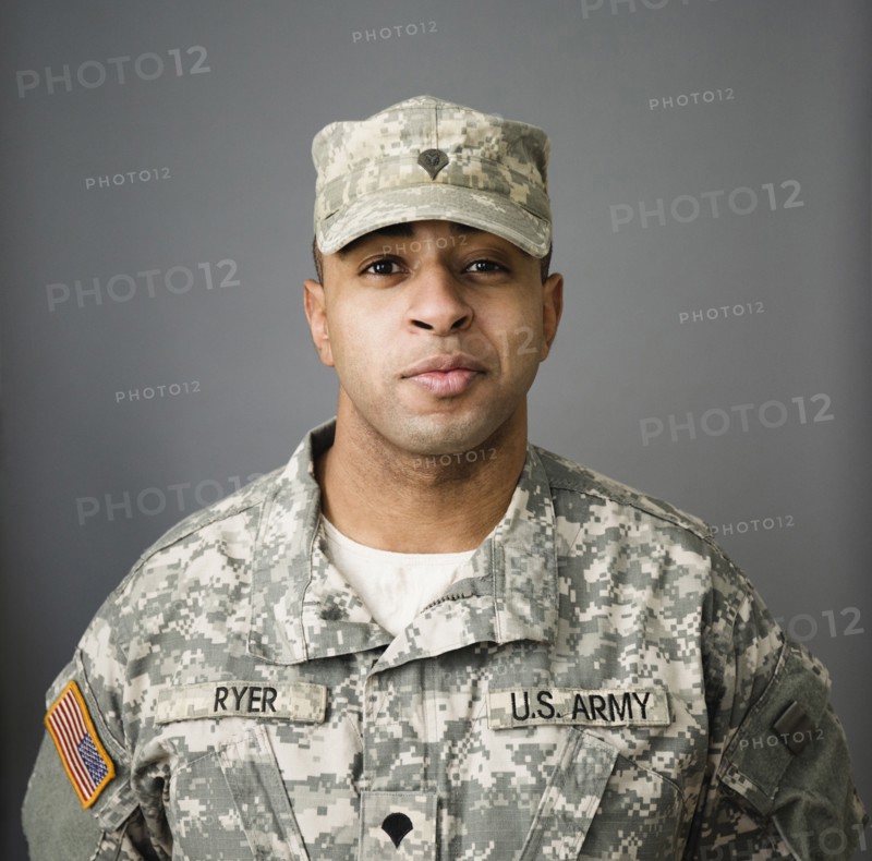 Close up of mixed race soldier smiling