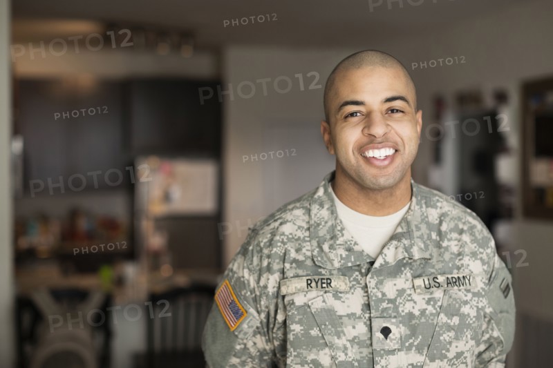 Mixed race man smiling in living room
