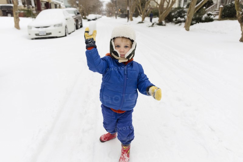 Caucasian boy throwing snowball
