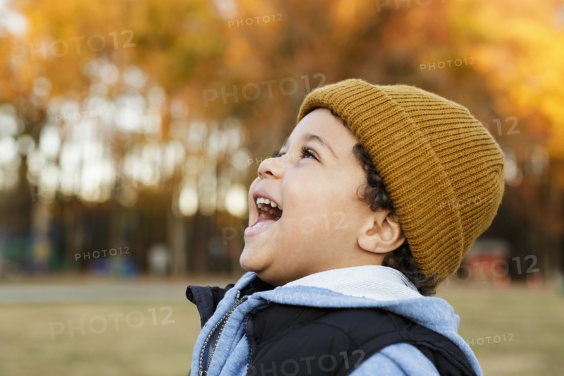 Mixed Race boy laughing in park