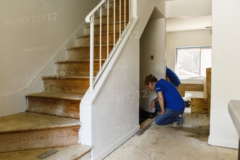 Native American woman remodeling floor