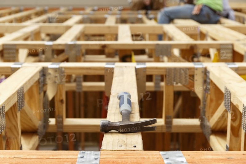 Hammer on the roof at construction site